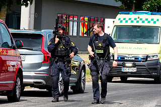 Armed police officers are seen at the scene of a shooting in Norresundby, northern Jutland, Denmark, on July 17, 2026.