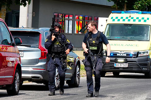 Armed police officers are seen at the scene of a shooting in Norresundby, northern Jutland, Denmark, on July 17, 2026.