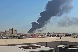 File Photo: Plume of black smoke billowing over the town of Mangaf, south of Kuwait City.