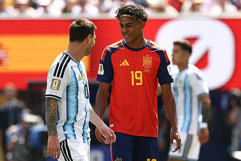 Argentina's forward #10 Lionel Messi (L) speaks with Spain's forward #19 Lamine Yamal during the 2026 World Cup football tournament final match between Spain and Argentina at the New York/New Jersey Stadium in East Rutherford on July 19, 2026.