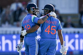 India's Virat Kohli (L) congratulates India's Rohit Sharma (R) as they celebrate his century during the third one-day international (ODI) cricket match between England and India at Lord's cricket ground in London on July 19, 2026.