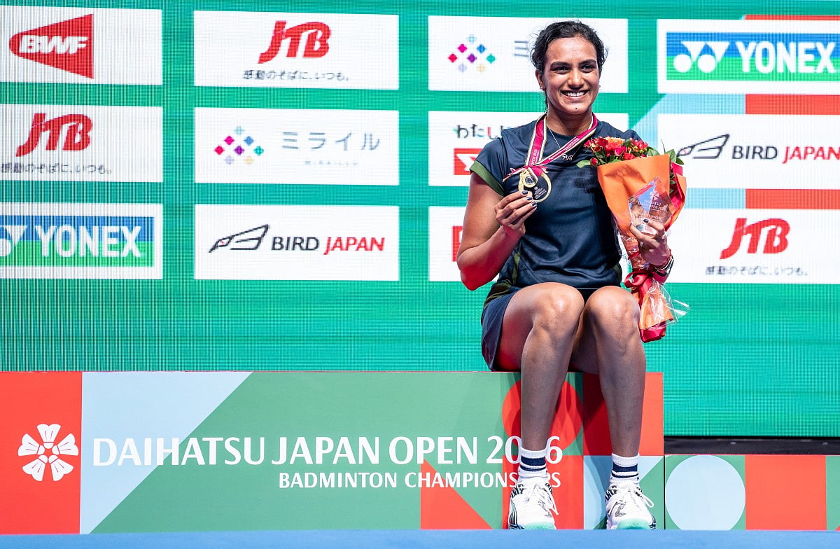 Gold medalist India’s Pusarla Venkata Sindhu poses on the podium after her victory against Japan’s Akane Yamaguchi in their women's singles final match of the Japan Open badminton tournament at Tokyo Gymnasium in Tokyo on July 19, 2026.