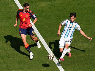 Argentina's Nicolas Tagliafico (3) passes the ball as Spain's Fabian Ruiz (8) looks on during the World Cup final in East Rutherford, N.J., near New York, Sunday, July 19, 2026. 