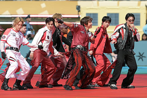 Members of the South Korean boy band BTS perform during the 2026 World Cup football tournament final match between Spain and Argentina at the New York/New Jersey Stadium in East Rutherford on July 19, 2026.
