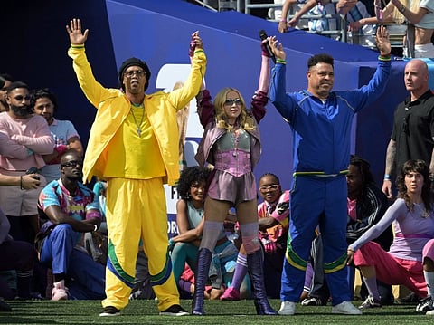 US singer Madonna performs with former Brazilian footballers Ronaldinho and Ronaldo during the halftime show of the 2026 World Cup football tournament final match between Spain and Argentina at the New York/New Jersey Stadium in East Rutherford on July 19, 2026.