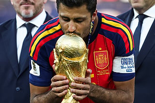 Spain's midfielder #16 Rodri kisses the trophy after winning the 2026 World Cup football tournament final match between Spain and Argentina at the New York/New Jersey Stadium in East Rutherford on July 19, 2026.