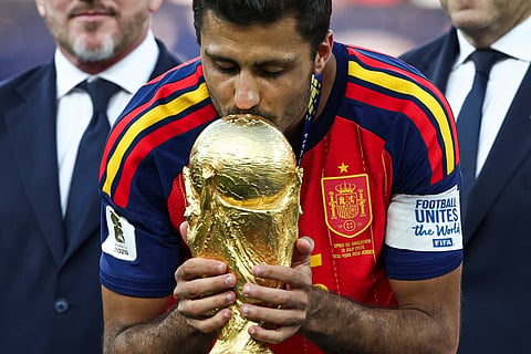 Rodri #16 of Spain kisses the FIFA World Cup Winner's Trophy as he receives the medal following the FIFA World Cup 2026 Final match between Spain and Argentina at New York New Jersey Stadium on July 19, 2026 in East Rutherford, New Jersey.