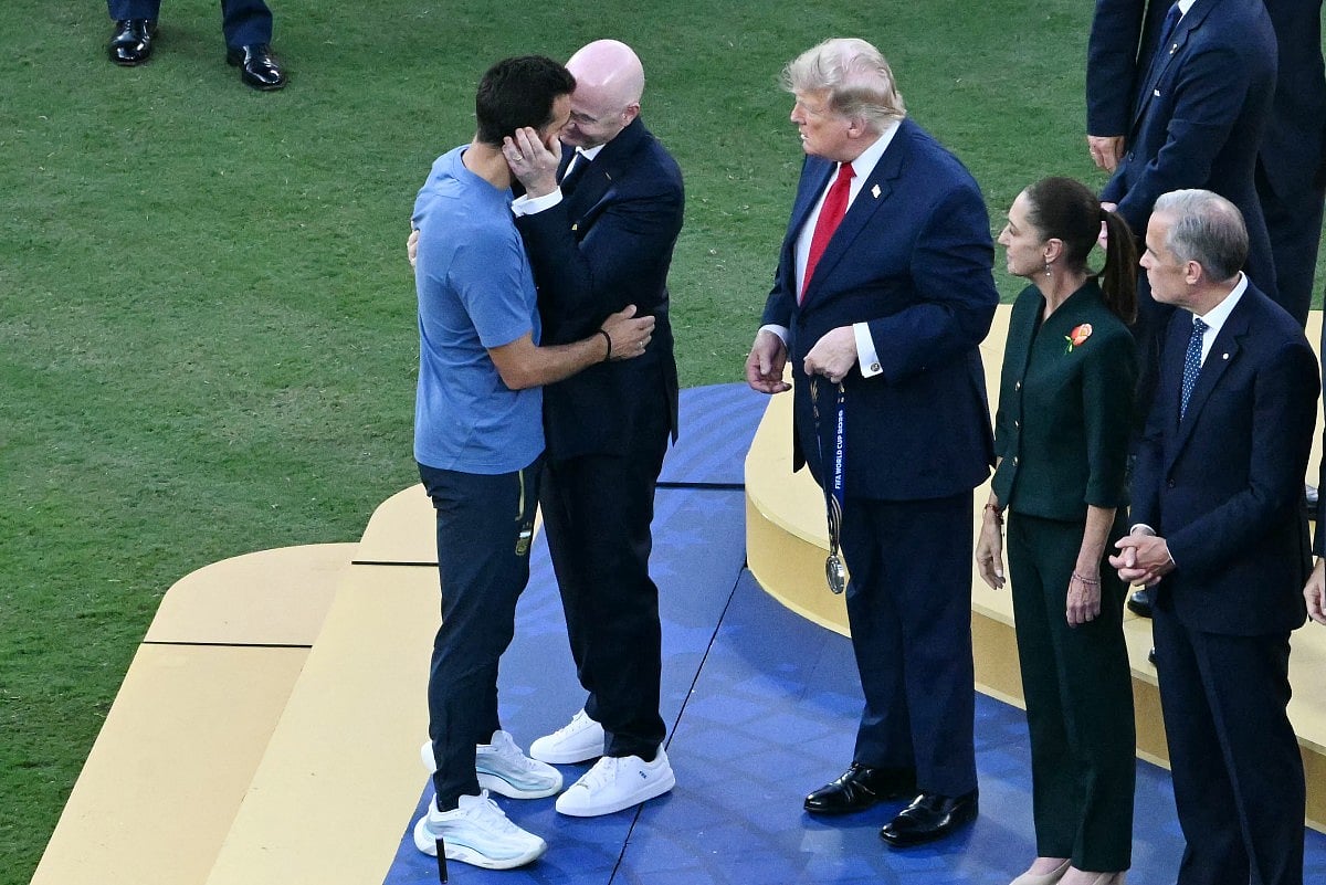 FIFA President Gianni Infantino greets Argentina's head coach Lionel Scaloni alongside US President Donald Trump, Mexican President Claudia Sheinbaum and Canada's Prime Minister Mark Carney during the trophy ceremony at the end of the 2026 World Cup football tournament final match between Spain and Argentina at the New York/New Jersey Stadium in East Rutherford on July 19, 2026.