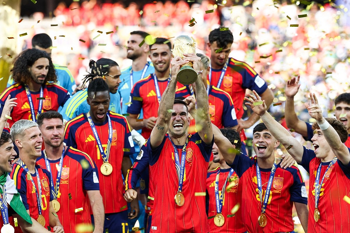 Spain's midfielder Fabian Ruiz lifts the trophy after winning the 2026 World Cup football tournament final match between Spain and Argentina at the New York/New Jersey Stadium in East Rutherford on July 19, 2026.