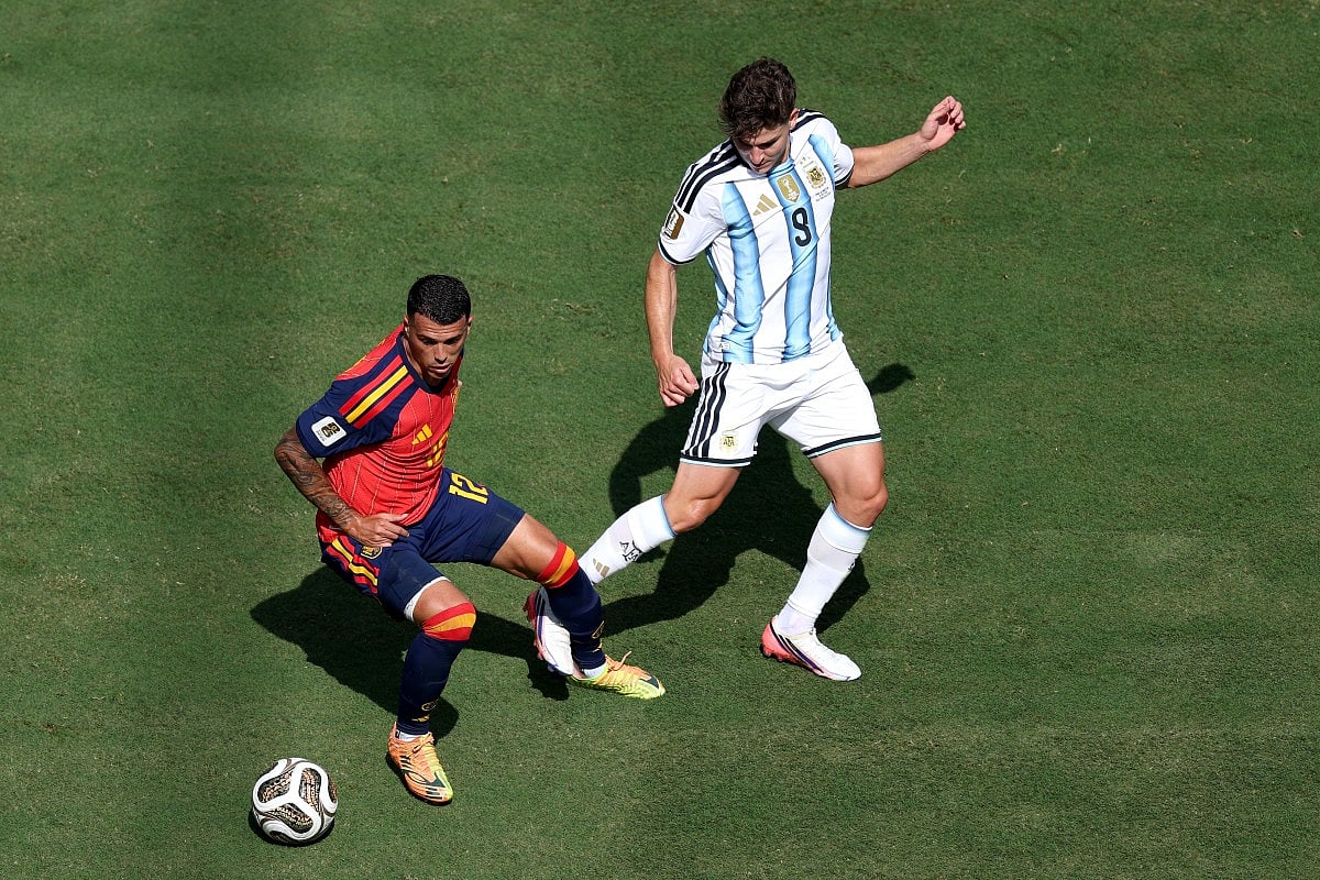 Pedro Porro #12 of Spain controls the ball against Julian Alvarez #9 of Argentina during the FIFA World Cup 2026 Final match between Spain and Argentina at New York New Jersey Stadium on July 19, 2026 in East Rutherford, New Jersey.