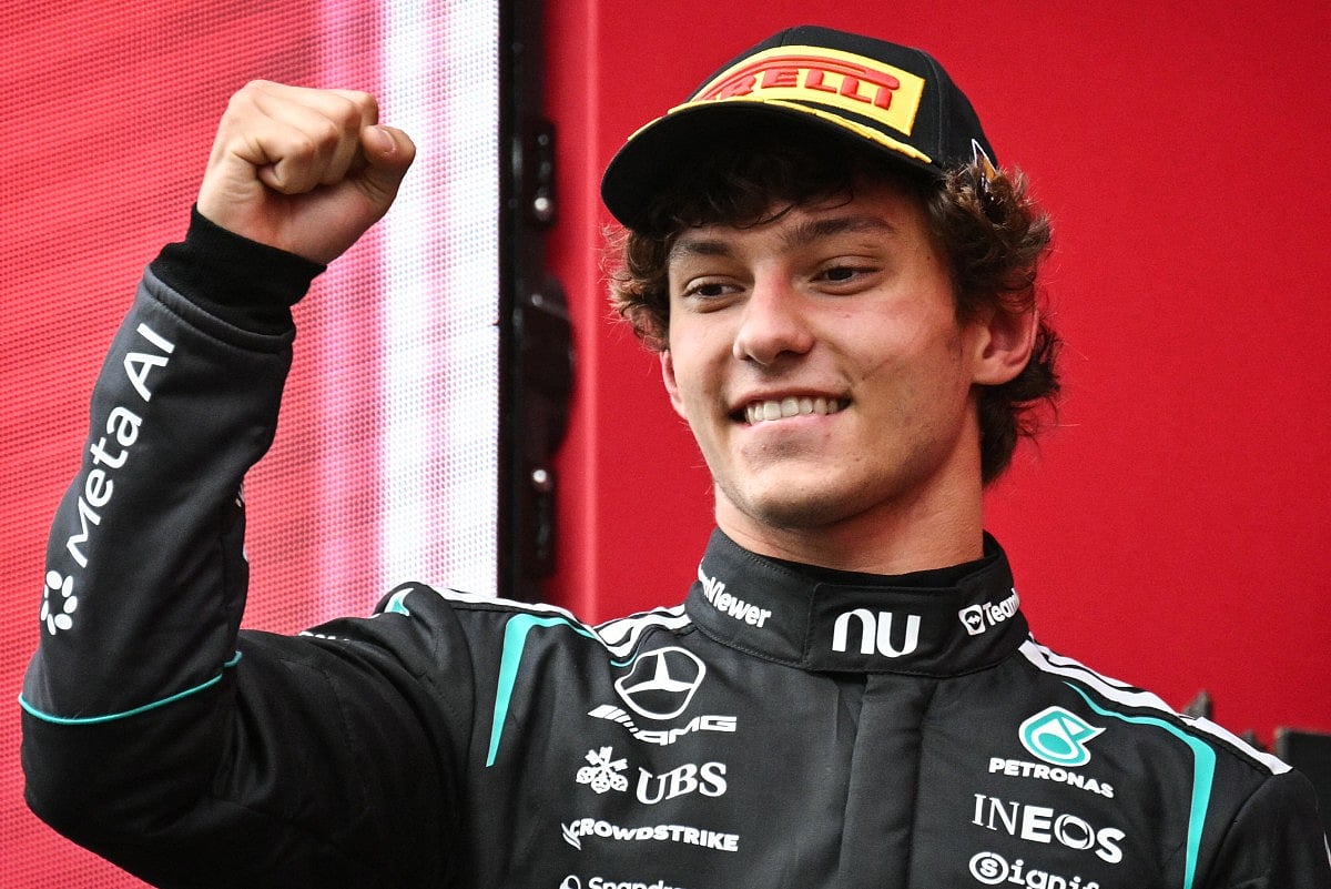 First-placed Mercedes' Italian driver Kimi Antonelli celebrates as he arrives on stage for the podium ceremony after competing in the Formula One Belgian Grand Prix at the Spa-Francorchamps circuit, in Spa, on July 19, 2026.