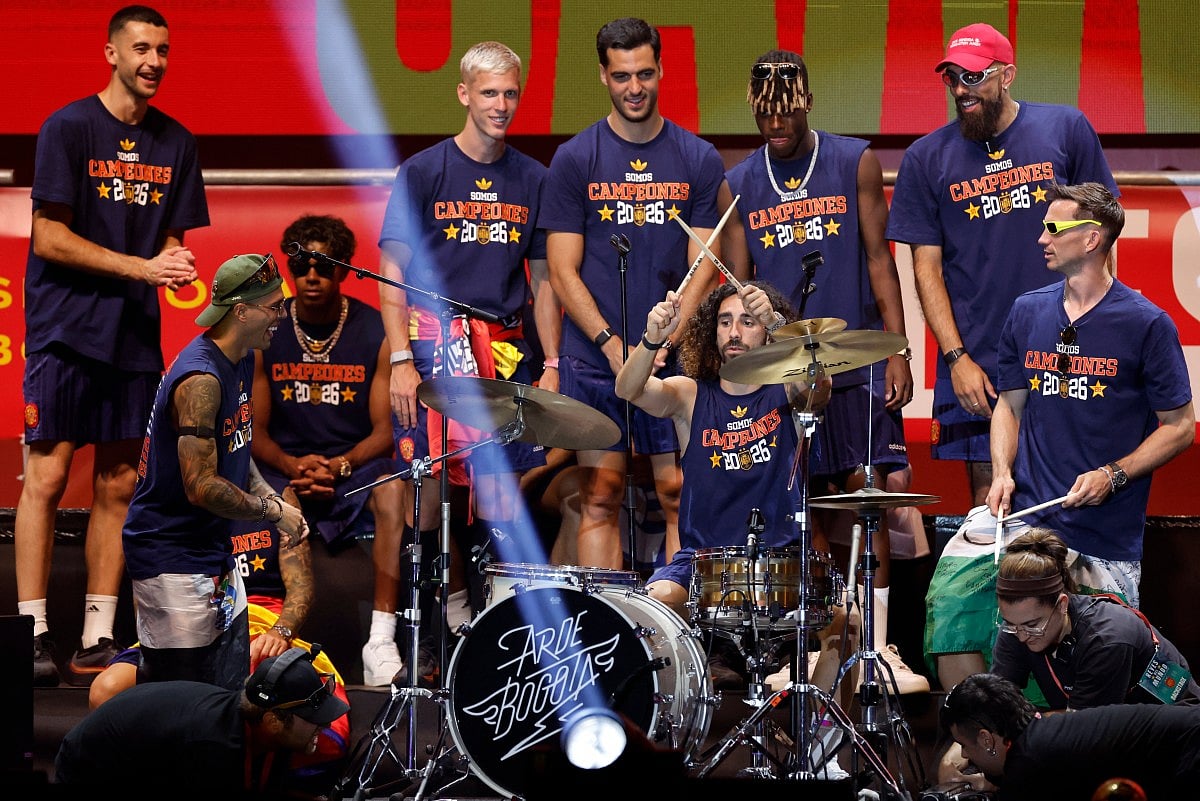 Spain's defender Marc Cucurella plays the drums as Spain's players celebrate on a stage at Cibeles Square in Madrid on July 20, 2026, one day after winning their second World Cup title following a 1-0 victory against Argentina.