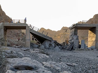 A heavily-damaged bridge which was hit by a US strike is pictured along the road connecting Roudan and Bandar Abbas in southern Iran on July 18, 2026. 