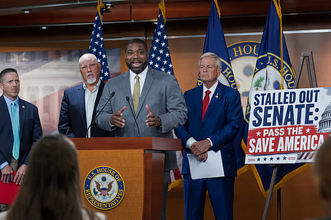 Rep. Byron Donalds, R-Florida, centre, flanked by Rep. Chip Roy, R-Texas, left, and Rep. Ralph Norman, R-South Carolina, right, speaks to reporters as the conservative House Freedom Caucus slams the Senate for not acting on the Save America Act at the Capitol in Washington, Thursday, June 25, 2026.