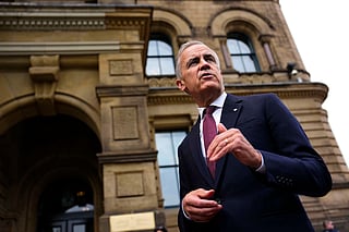 Canada Prime Minister Mark Carney makes a statement outside the Office of the Prime Minister and Privy Council in Ottawa, on Tuesday, July 21, 2026.(Justin Tang/The Canadian Press via AP)