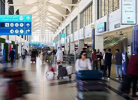 Passengers at the departures area of Dubai International Airport.