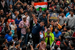 Demonstrators shout slogans during a protest gathering in Mumbai on July 22, 2026 in solidarity with the ongoing protest at New Delhi's Jantar Mantar demanding the resignation of India's Education Minister Dharmendra Pradhan over alleged NEET exam irregularities.