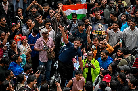 Demonstrators shout slogans during a protest gathering in Mumbai on July 22, 2026 in solidarity with the ongoing protest at New Delhi's Jantar Mantar demanding the resignation of India's Education Minister Dharmendra Pradhan over alleged NEET exam irregularities.