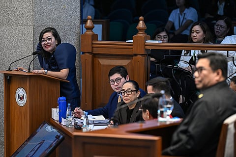 Philippine Congresswoman Gerville Luistro (L), a member of the prosecution panel, looks at National Bureau of Investigation (NBI) Director Melvin Matibag (R) during proceedings for the impeachment trial of Philippine Vice-President Sara Duterte at the Philippine Senate in Pasay City, Metro Manila on July 22, 2026.