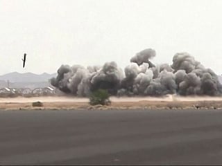 This screen grab taken from video footage released by the Houthi rebels' Al-Masirah TV channel and made available via AFPTV on July 13, 2026, shows airstrikes hitting Sanaa airport. 