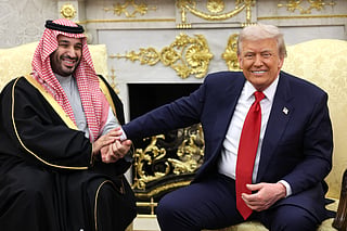 U.S. President Donald Trump (R) takes the hand of Crown Prince and Prime Minister Mohammed bin Salman of Saudi Arabia during a bilateral meeting in the Oval Office of the White House on November 18, 2025 in Washington, DC. 