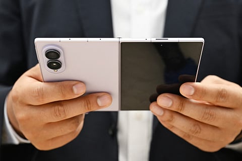 A customer tries out a newly-released Samsung Galaxy Z Fold8 smartphone at a Samsung store in Seoul on July 23, 2026.