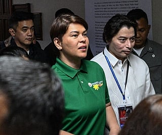 Philippine Vice President Sara Duterte arrives with her lawyers before the start of the impeachment trial at the Senate of the Philippines in Pasay, Metro Manila on July 7, 2026.
