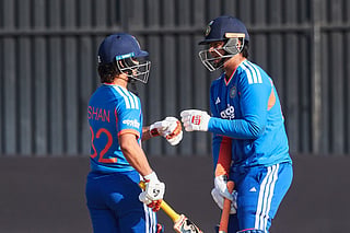 India's Vaibhav Sooryavanshi (R) bumps fists with Ishan Kishan (L) during the first match in the One Day International cricket series played between Zimbabwe and India at Harare Sports Club on July 23, 2026 in Harare.
