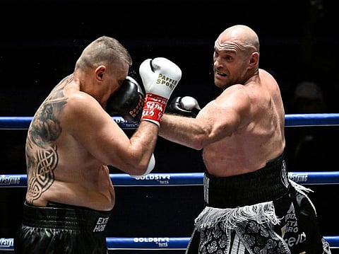 Britain's Tyson Fury (R) trades blows with Poland's Mariusz Wach (L) during a charity boxing bout in Pattaya on July 24, 2026.