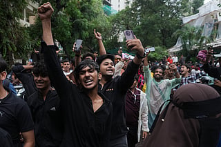 Protesters shout slogans during a demonstration demanding educational reforms as part of the Cockroach Janta Party's ongoing protest movement in Mumbai, India, Thursday, July 23, 2026. (AP Photo/Rafiq Maqbool)