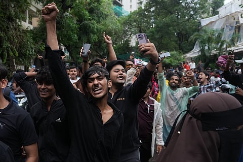 Protesters shout slogans during a demonstration demanding educational reforms as part of the Cockroach Janta Party's ongoing protest movement in Mumbai, India, Thursday, July 23, 2026. (AP Photo/Rafiq Maqbool)