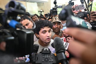 Cockroach Janta Party (CJP) spokesperson Saurav Das (C) addresses the media as he leaves after meeting Union Ministers Jitendra Singh and Jagat Prakash Nadda at Constitution Club in New Delhi on July 24, 2026 during the ongoing protest to demand the resignation of India's Education Minister Dharmendra Pradhan over alleged NEET exam irregularities.