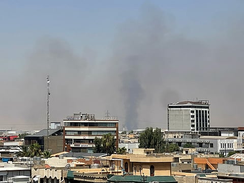 Black smoke rises following explosions near a military base hosting US forces in the northern Iraqi city of Irbil, on Friday, July 24, 2026.
