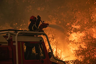 French firefighters trying to extinguish the wildfire near Saumos and Sainte-Hélène, northwest of Bordeaux.