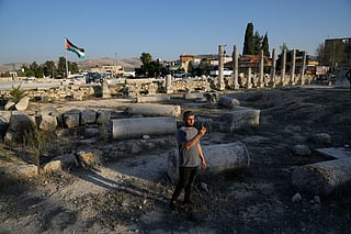 FILE - A Palestinian visitor takes a photo at the Roman historical site in the West Bank town of Sebastia Thursday, Nov. 20, 2025. (AP Photo/Nasser Nasser, File)