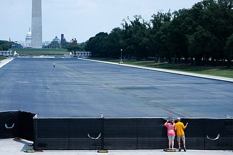 President says vandals were responsible after charges against former Olympian were dropped.