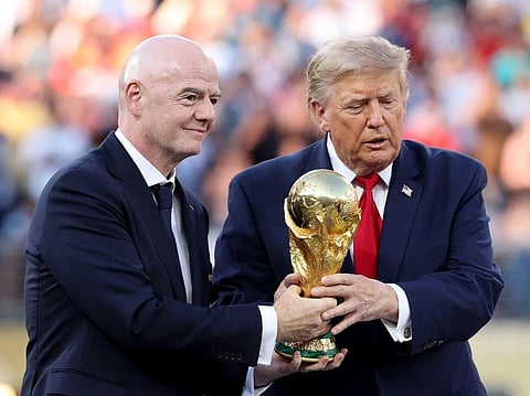 US President Donald Trump and FIFA President Gianni Infantino hold the FIFA World Cup Winner's Trophy before handing over to captain Rodri #16 of Spain at the award ceremony following the FIFA World Cup 2026 Final match between Spain and Argentina at New York New Jersey Stadium on July 19, 2026 in East Rutherford, New Jersey.