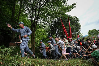 Chinese tourists reenact communist victory