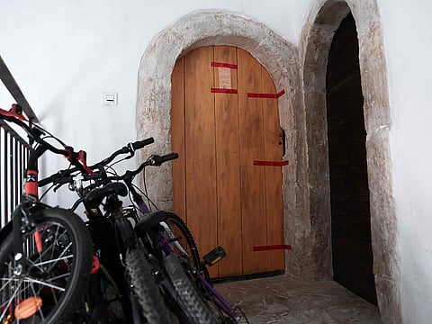 This photograph shows the French police seals affixed to the door of an appartment  in Orange, southern France, on July 28, 2026, after the bodies of five deceased infants were discovered. 