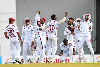 West Indies players celebrate their 90-run victory over Pakistan on the fourth day of the first Test cricket match between West Indies and Pakistan at the Brian Lara Cricket Academy in Tarouba, Trinidad and Tobago, on July 28, 2026.