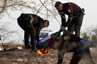 Police officers and forensic teams work at the scene of a small-plane crash in the Vista Alegre district of Nazca, Peru, on August 1, 2026.