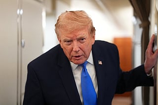 US President Donald Trump speaks to the press aboard Air Force One on August 2, 2026.
