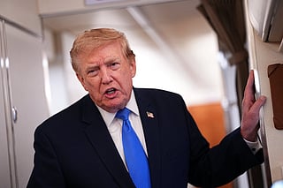 US President Donald Trump speaks to the press aboard Air Force One on August 2, 2026.