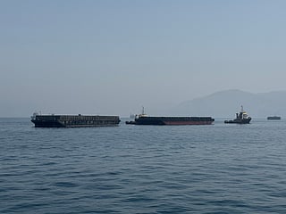Iran says talks with Oman focused on designating temporary route for safe shipping in Hormuz Strait.