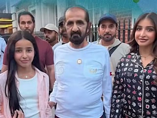 Sheikh Mohammed stopped to greet members of the public and posed for pictures.