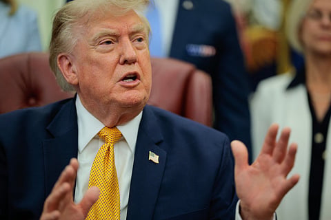 President Donald Trump speaks to the media after signing an executive order establishing the President's Military Spouse Commission in the Oval Office at the White House on August 03, 2026 in Washington, DC.