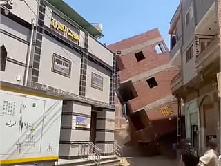 Videos widely shared on social media captured the moment the building gave way as people rushed away from the area. 