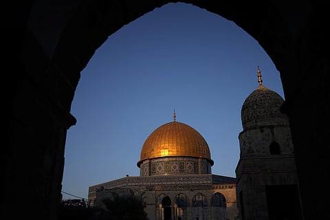 The sun reflects off the golden dome of the Dome of the Rock, part of the Al Aqsa mosque complex.