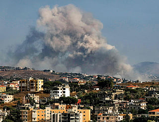 Smoke rises following an Israeli controlled-explosion on the village of Kfartibnit as seen from Nabatieh in southern Lebanon on July 29, 2026. While violence has declined since the signing of a preliminary US-Iran deal in June and the Lebanon-Israel agreement, Lebanon continues to report intermittent Israeli strikes and artillery shelling on the south. Lebanon's army on July 26 condemned ongoing Israeli military activities that it said were preventing its full deployment under the framework deal. (Photo by Ammar Ammar / AFP) /