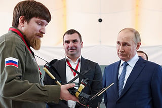 FILE - Russian President Vladimir Putin, right, speaks with Vladimir Tkachuk, the head of the Uraldronzavod, during his visit to the Special Technology Centre in St. Petersburg, Russia, Thursday, Sept. 19, 2024.
